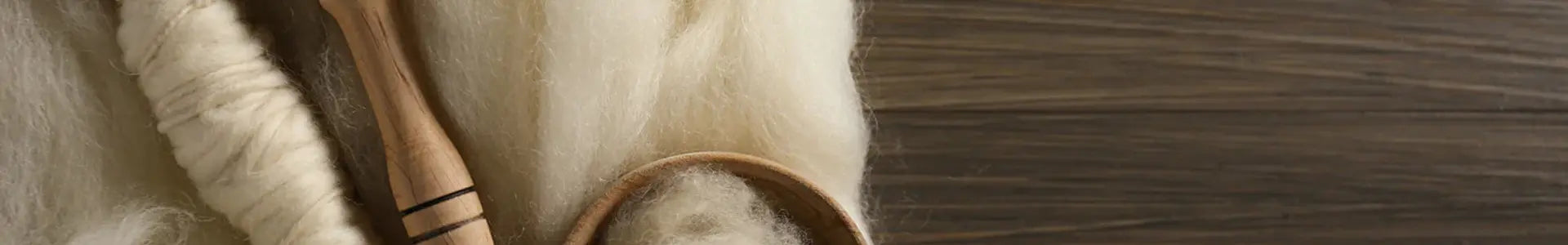 Sample of wool on wooden background