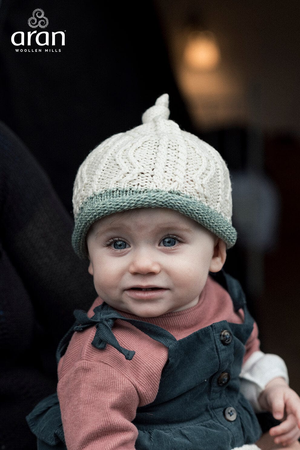 Aran Woollen Mills Supersoft Merino Baby Cap with Green Trim
